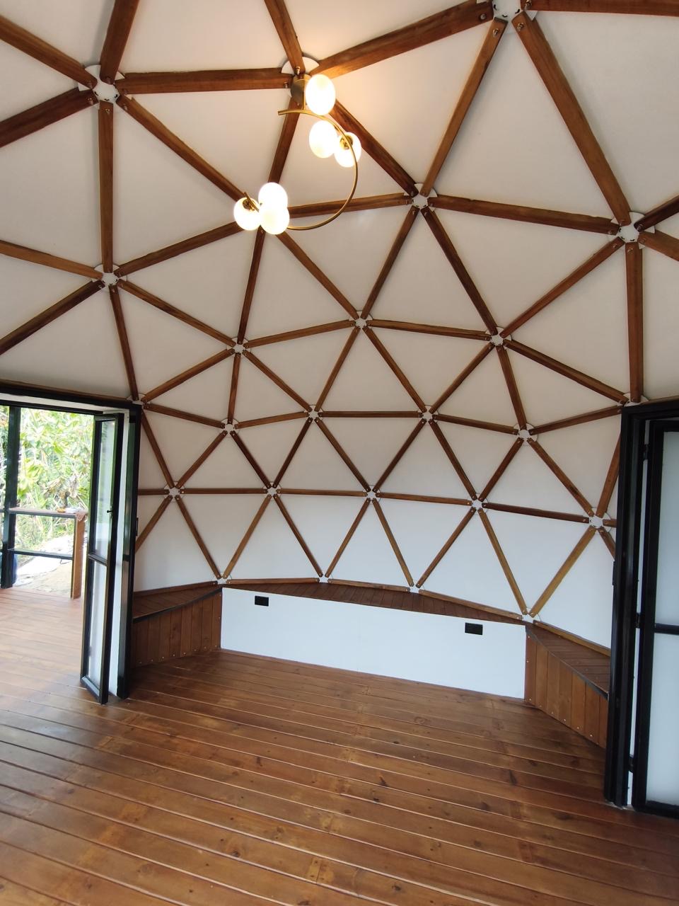The geometric wooden ceiling and installed lighting