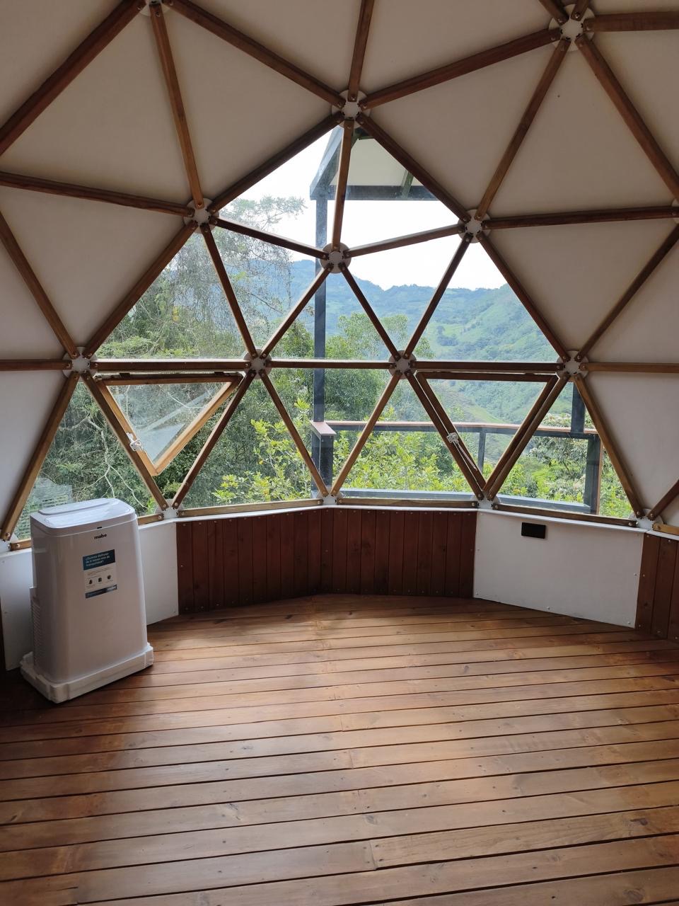 A mountain view through the geometric dome windows